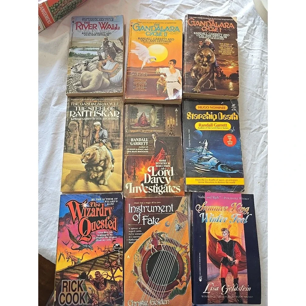 Lot of 9 Randall Garrett, Lisa Goldstein, Rick Cook & Christie Golden‎ PB Books
